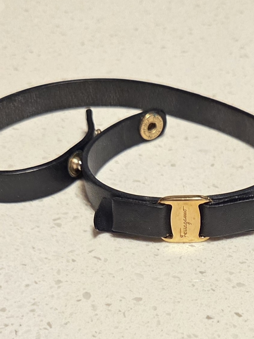 Salvatore Ferragamo Black Leather Double-Wrap Bracelet with Bow and Gold Logo.